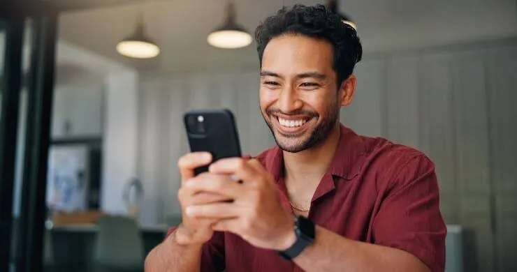 A person checking a loan approval notification on their phone